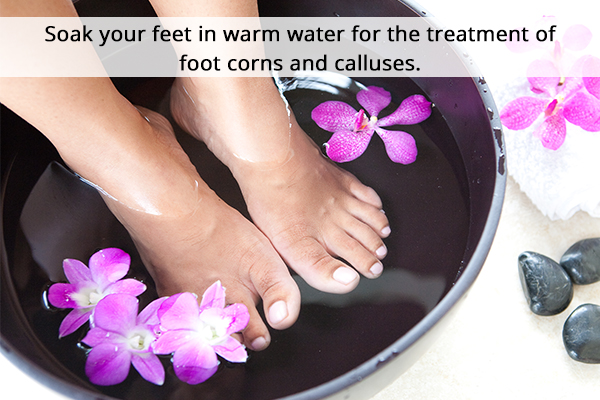 soaking feet in warm water can help treat foot corns