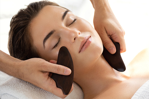 try Gua sha therapy to reduce skin inflammation